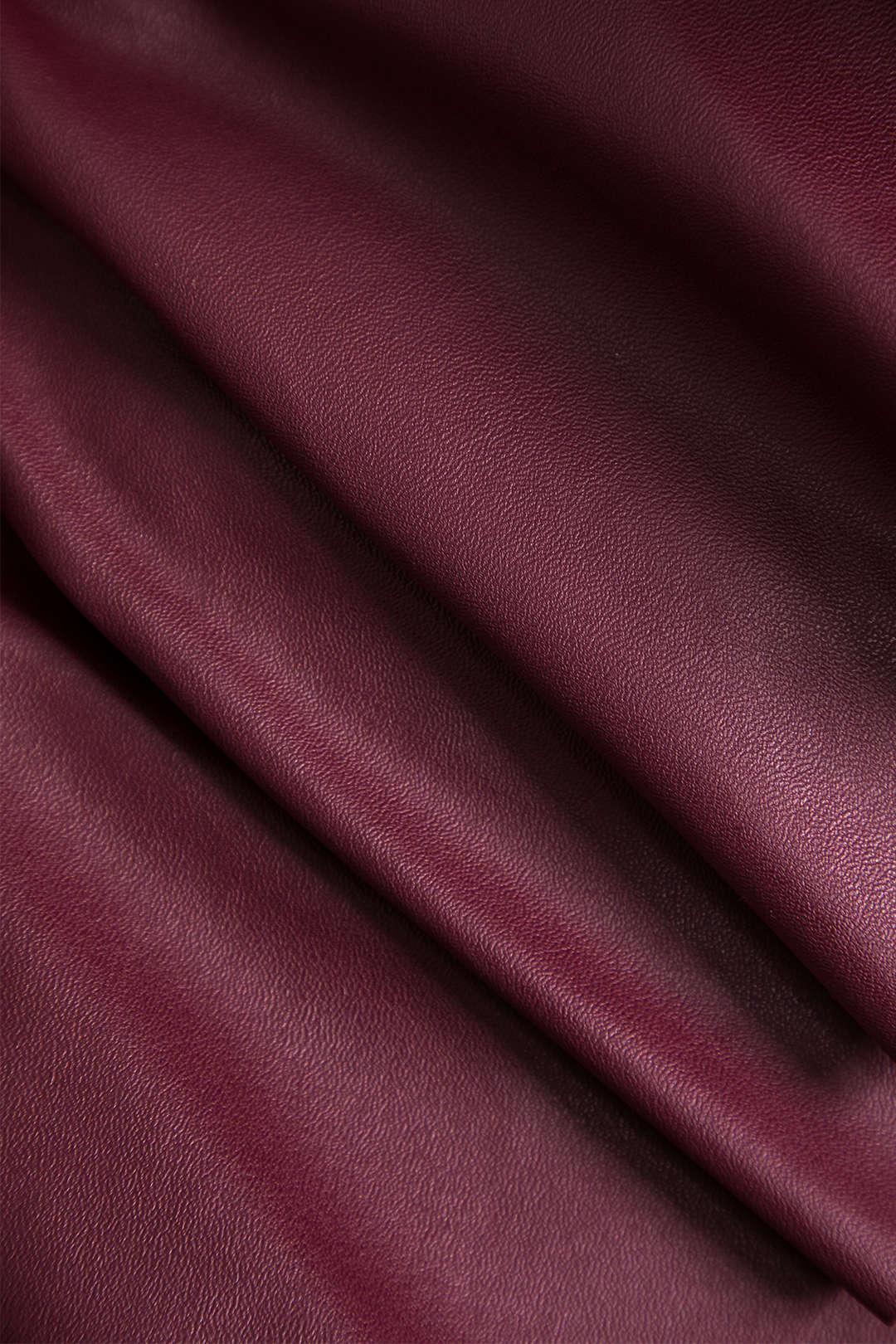 חצאית שכבות אסימטרית דמוית עור אחידה 