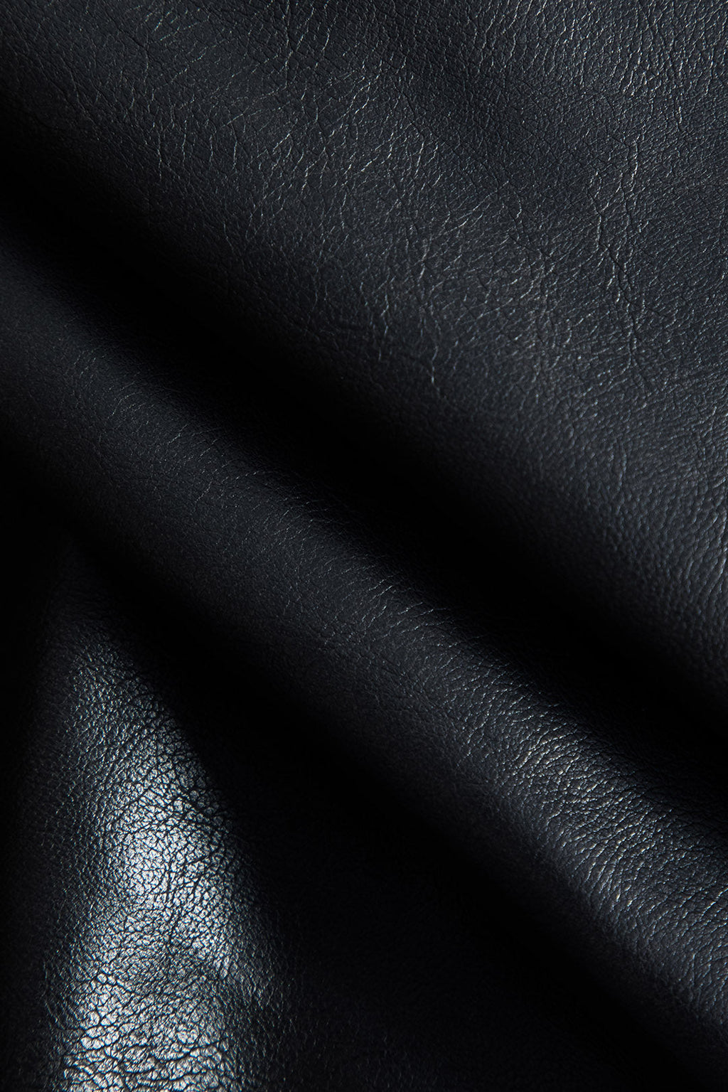 חצאית פרווה דמוית עור מבד טלאים 