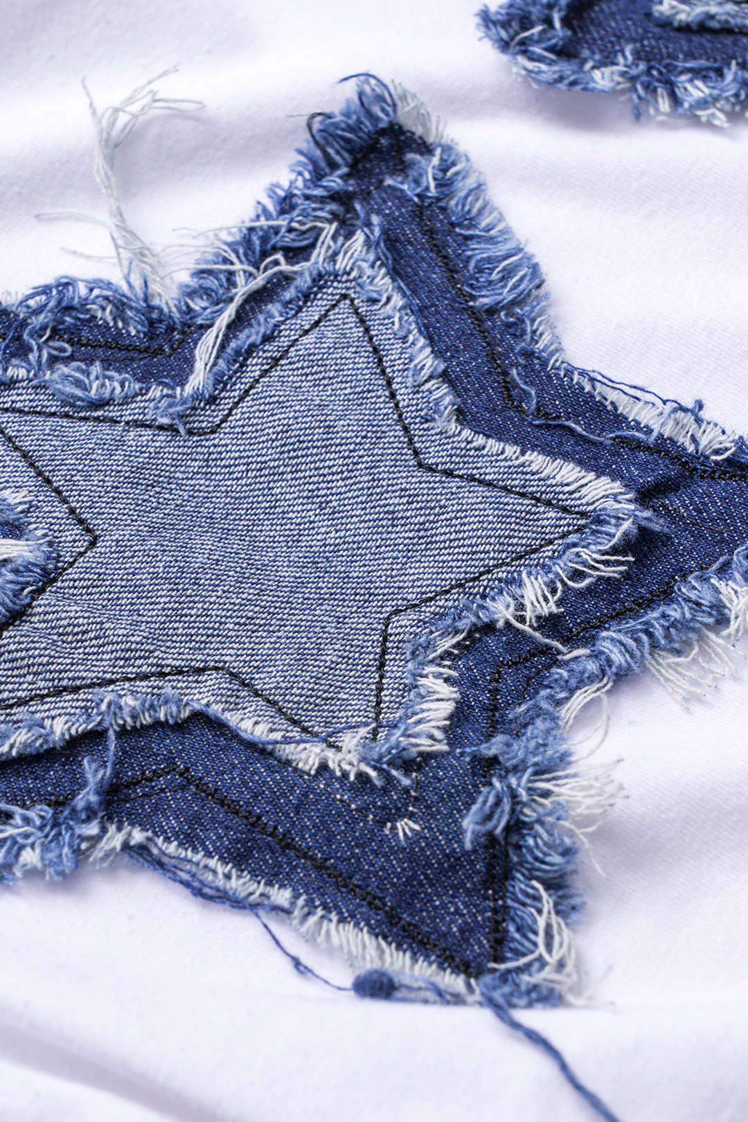 Camiseta Estrella Rasgada Patchwork Nudo Torcido MangaCorta